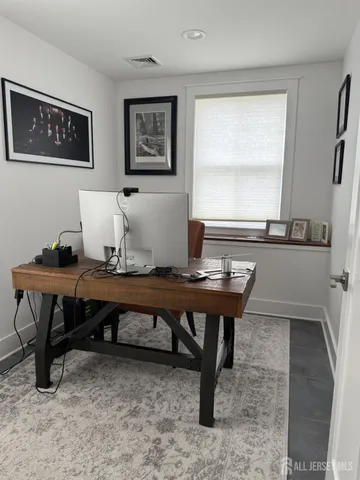 a view of a workspace with furniture