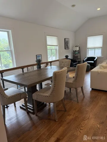 a living room with furniture a window and a table
