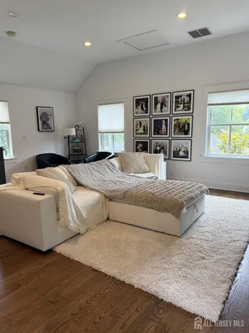 a bedroom with a large bed and a window