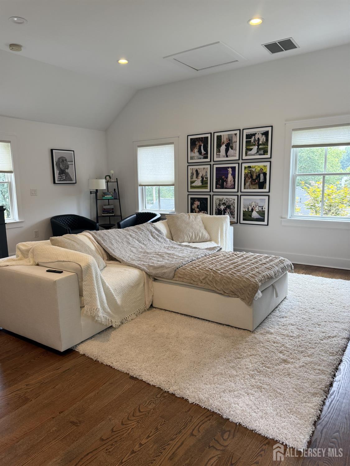 66 Main Street, Unit 3 Peapack, NJ 07977 - Photo 7 of 13 a bedroom with a large bed and a window