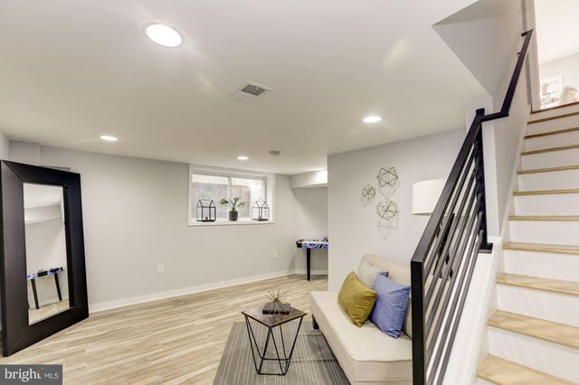 a view of a livingroom with furniture and wooden floor