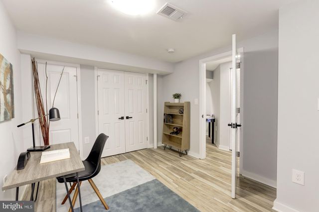 a view of a livingroom with furniture and entryway