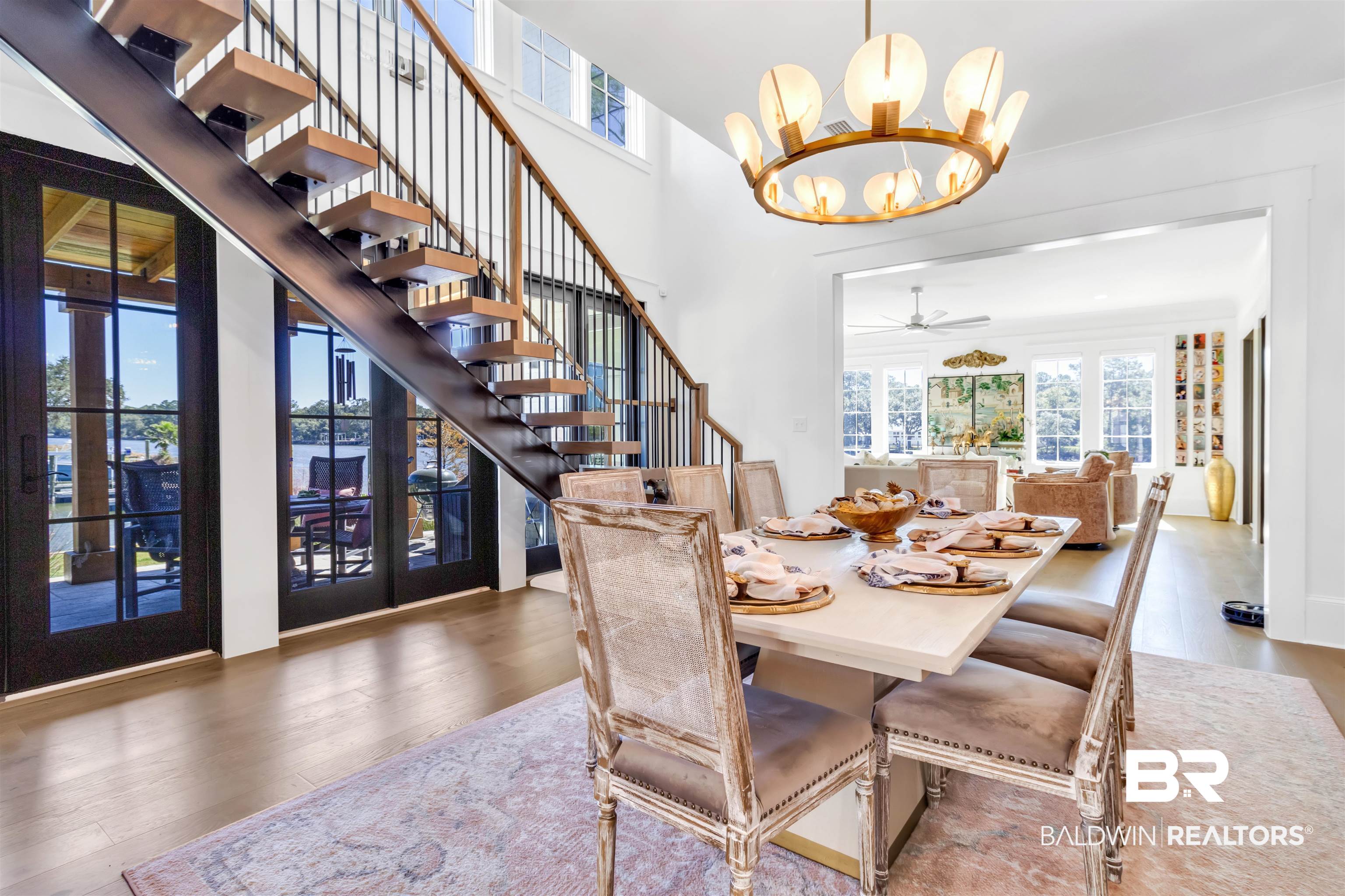 885 Inlet Circle Gulf Shores, AL 36542 - Photo 12 of 36 Dining space featuring dark hardwood / wood-style floors and ceiling fan with notable chandelier