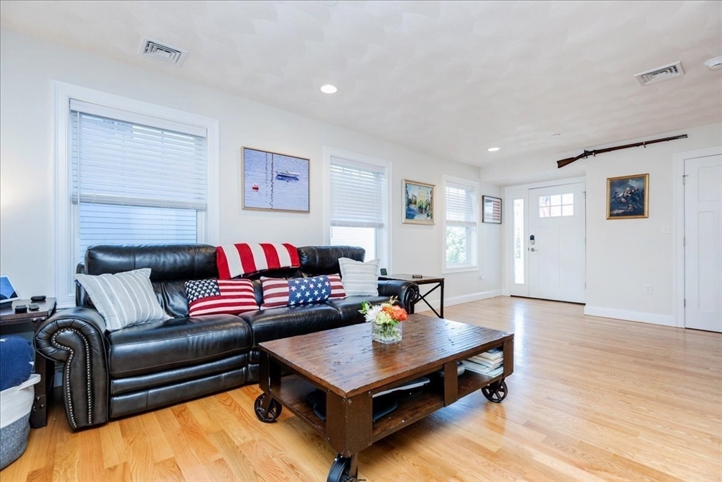 105 Green Street, Unit 4 Marblehead, MA 01945 - Photo 11 of 30 a living room with furniture a rug and a window