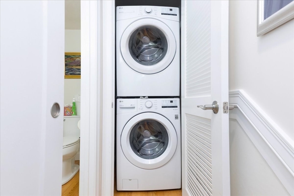 105 Green Street, Unit 4 Marblehead, MA 01945 - Photo 12 of 30 a view of a hallway with washer and dryer