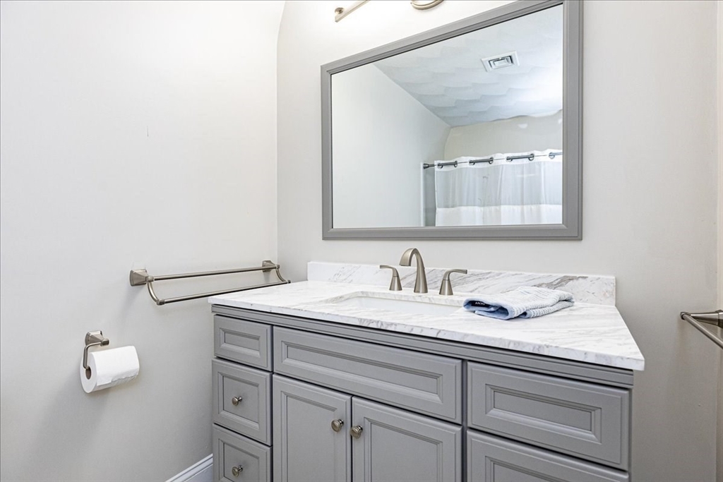 105 Green Street, Unit 4 Marblehead, MA 01945 - Photo 15 of 30 a bathroom with a sink and a mirror