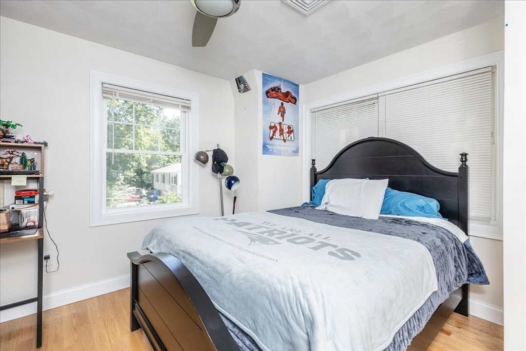 105 Green Street, Unit 4 Marblehead, MA 01945 - Photo 20 of 30 a bedroom with a bed and a large window