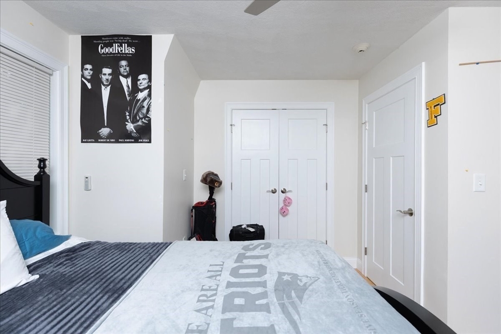105 Green Street, Unit 4 Marblehead, MA 01945 - Photo 21 of 30 a bedroom with a bed and closet