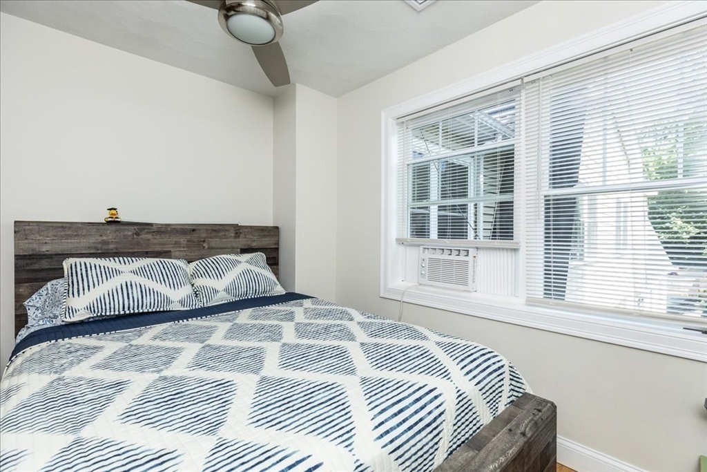 105 Green Street, Unit 4 Marblehead, MA 01945 - Photo 22 of 30 a bedroom with a bed and a window