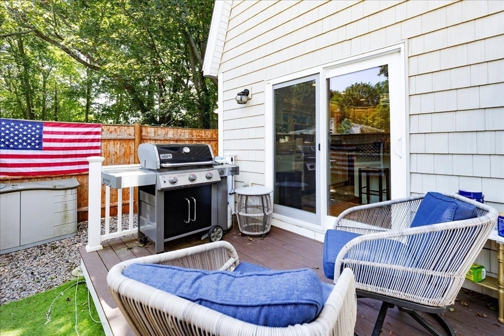 105 Green Street, Unit 4 Marblehead, MA 01945 - Photo 23 of 30 a living room with furniture and a fireplace