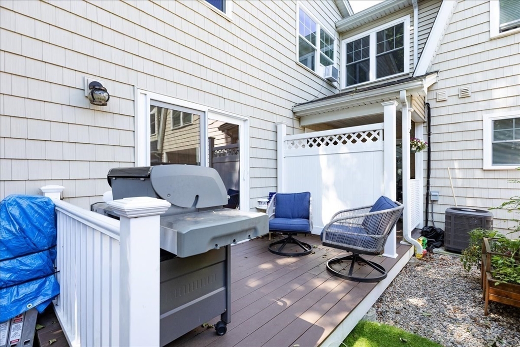 105 Green Street, Unit 4 Marblehead, MA 01945 - Photo 24 of 30 a view of a patio with a table and chairs