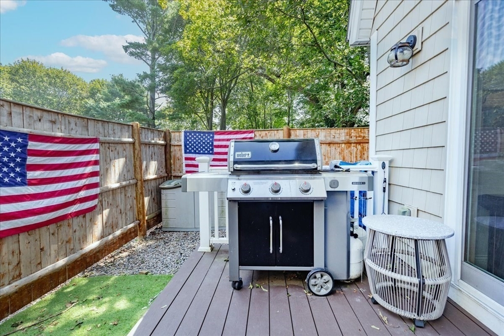 105 Green Street, Unit 4 Marblehead, MA 01945 - Photo 25 of 30 a view of a deck with wooden floor and fence