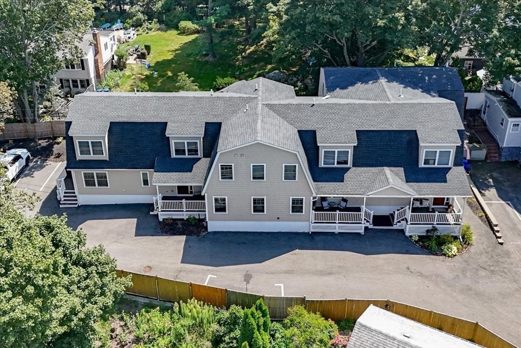 105 Green Street, Unit 4 Marblehead, MA 01945 - Photo 28 of 30 an aerial view of a house with a yard and sitting area