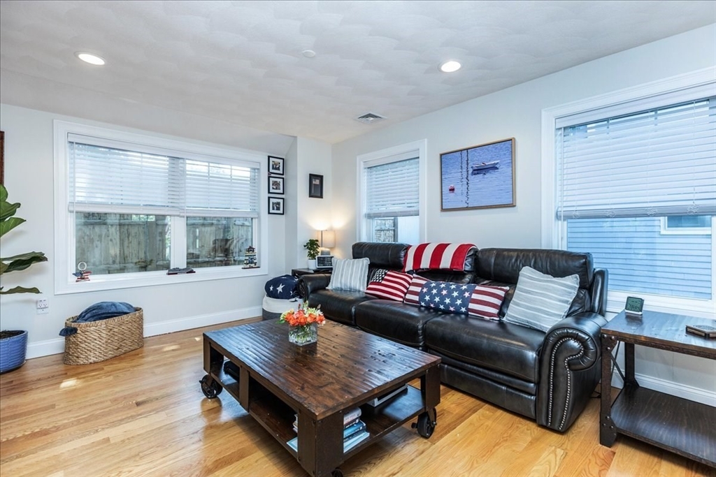 105 Green Street, Unit 4 Marblehead, MA 01945 - Photo 9 of 30 a living room with furniture and a large window