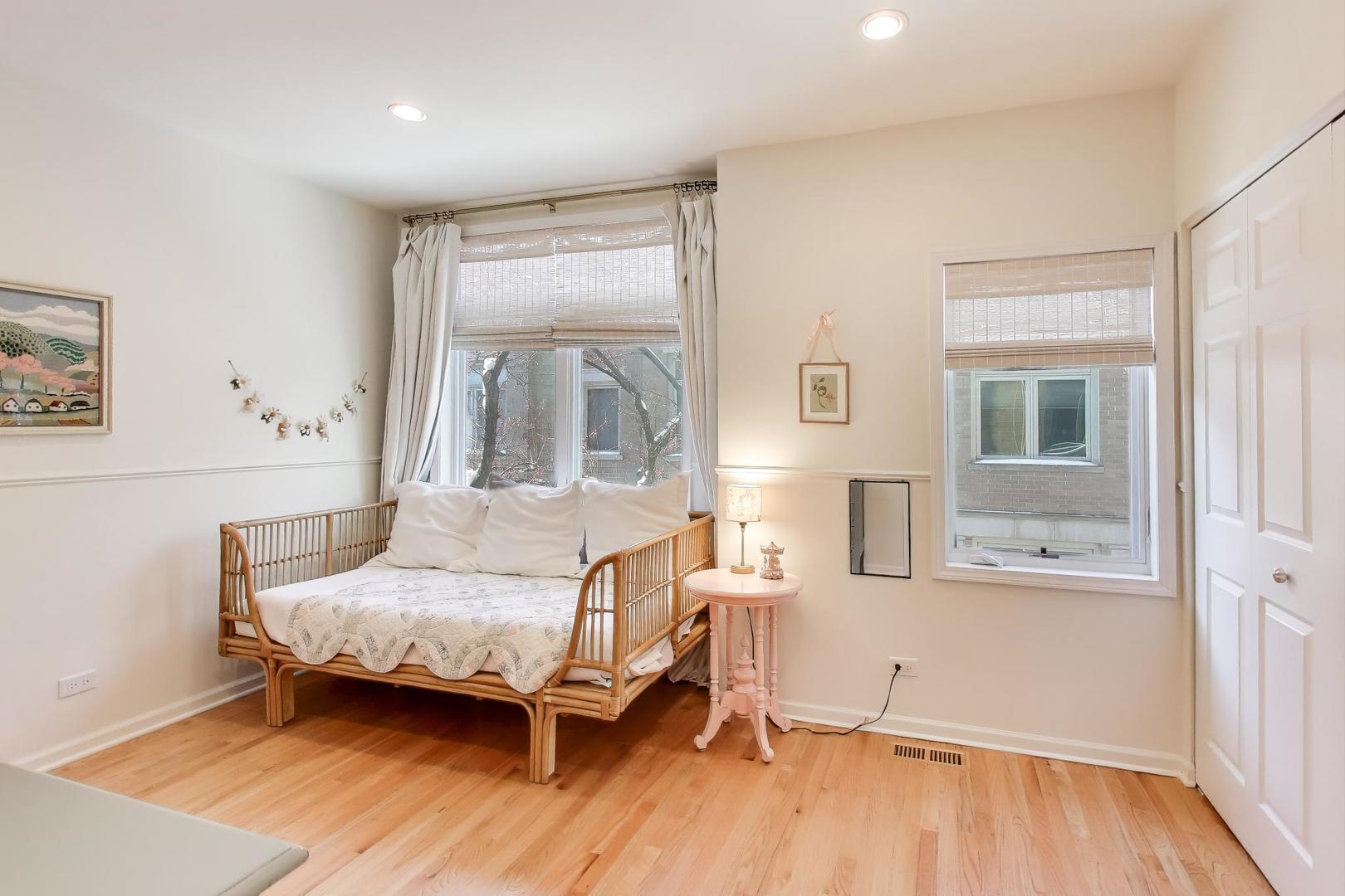 2737 North Janssen Avenue, Unit B Chicago, IL 60614 - Photo 14 of 31 a bedroom with a bed and wooden floor