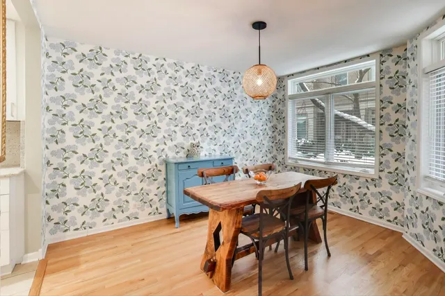 a view of a dining room with furniture and wooden floor