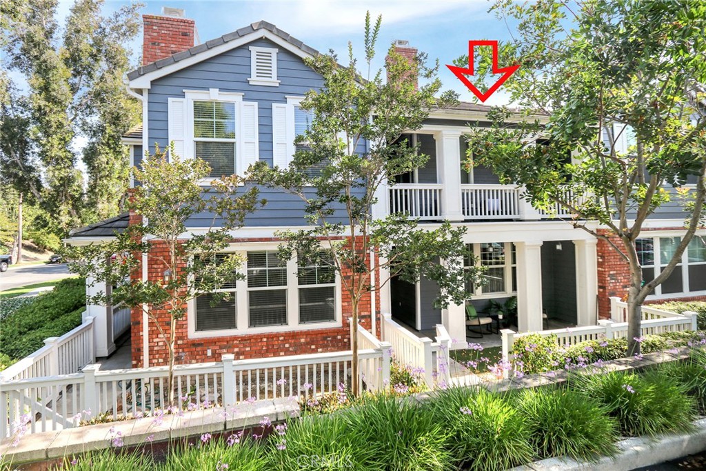 163 Sklar Street, Unit 54 Ladera Ranch, CA 92694 - Photo 1 of 1 front view of a house with a yard