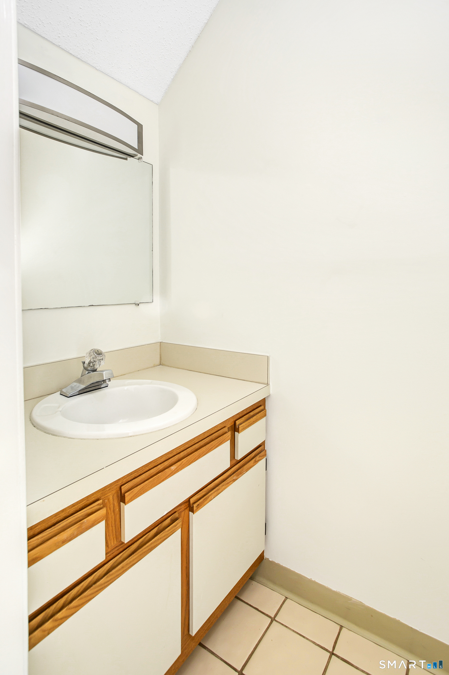 9 Talcott Forest Road, Unit C Farmington, CT 06032 - Photo 11 of 20 a bathroom with a sink and a mirror