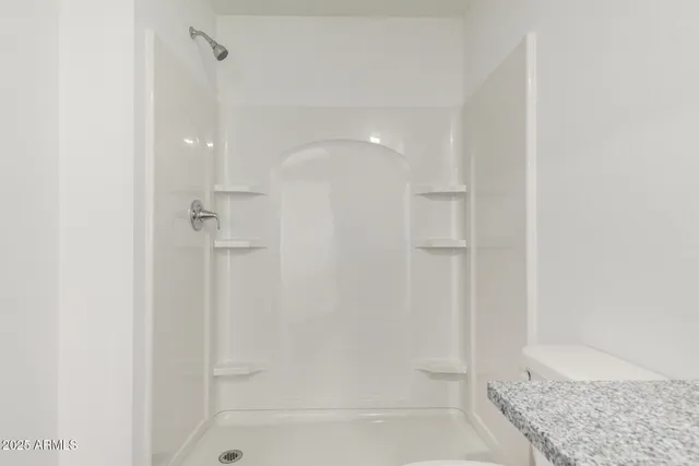 a bathroom with a bathtub and shower