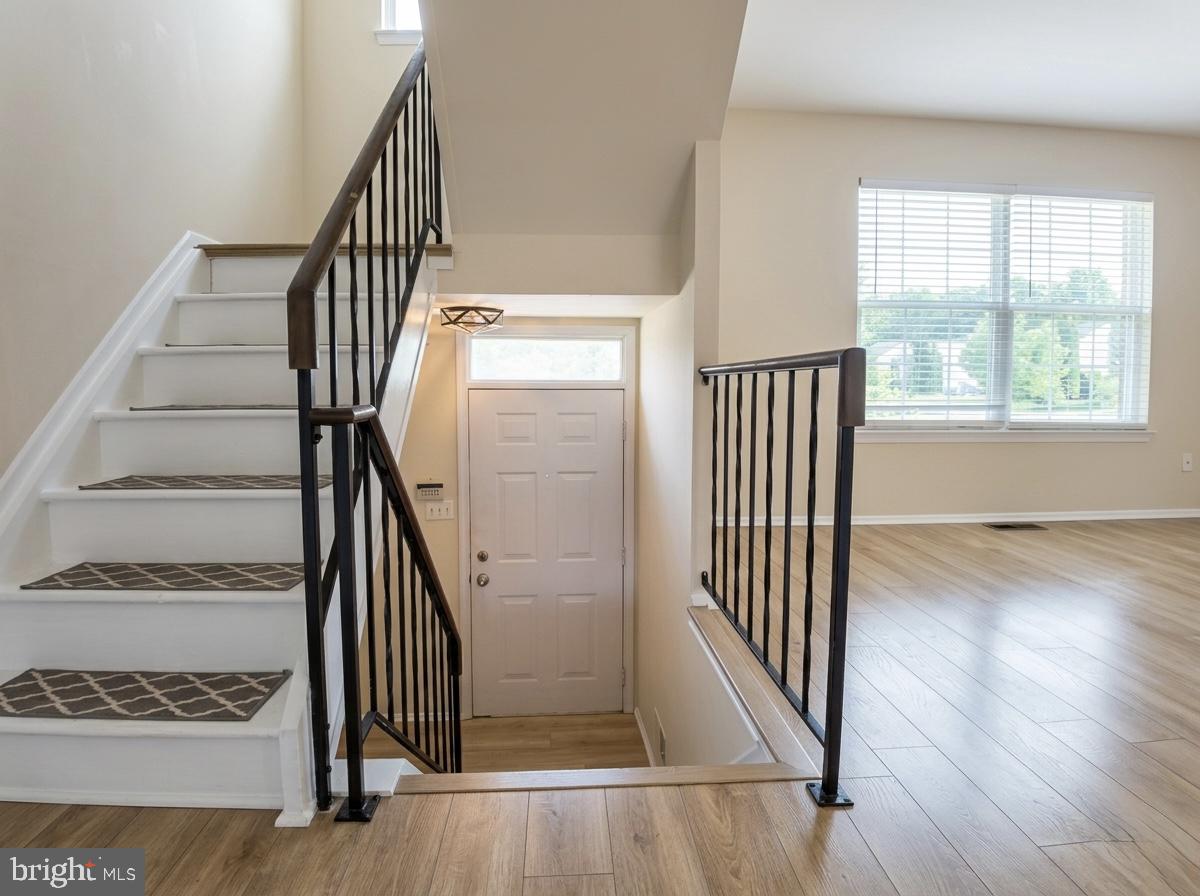3614 Fawn Spring Court Baltimore, MD 21234 - Photo 10 of 22 an entryway with wooden floor and stairs