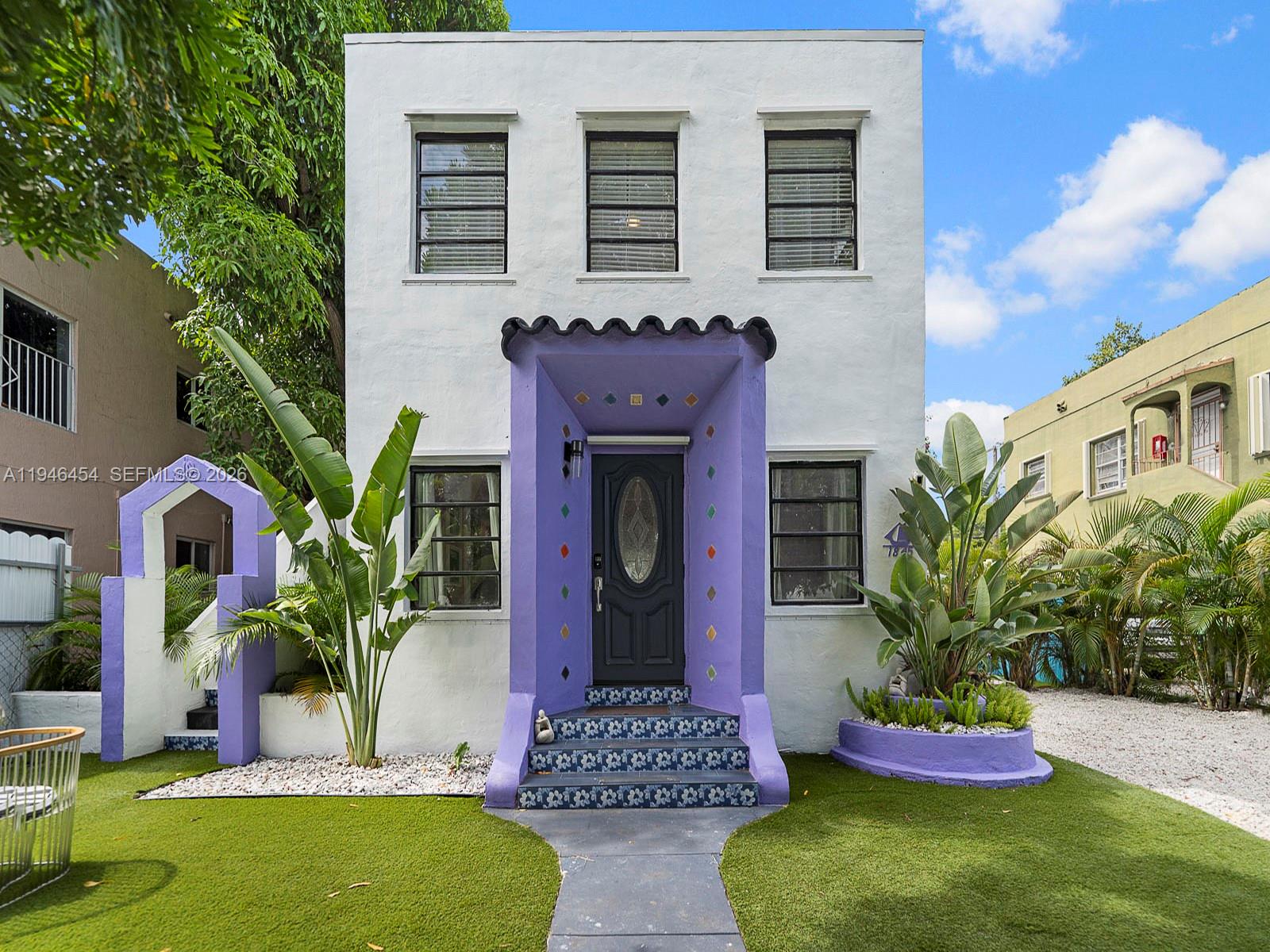 a front view of a house with yard