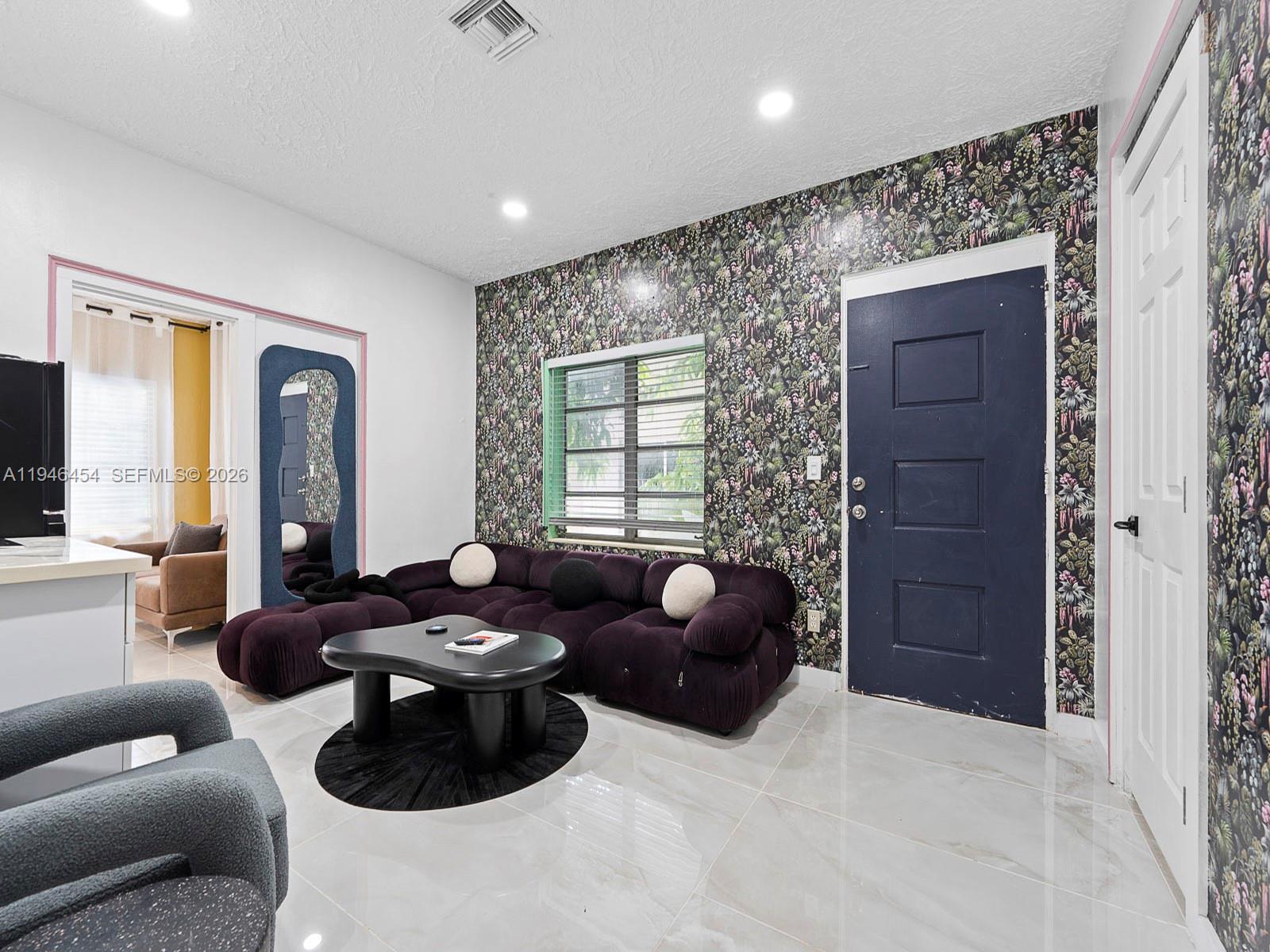 1845 Southwest 9th Street Miami, FL 33135 - Photo 13 of 31 a living room with furniture and a large window