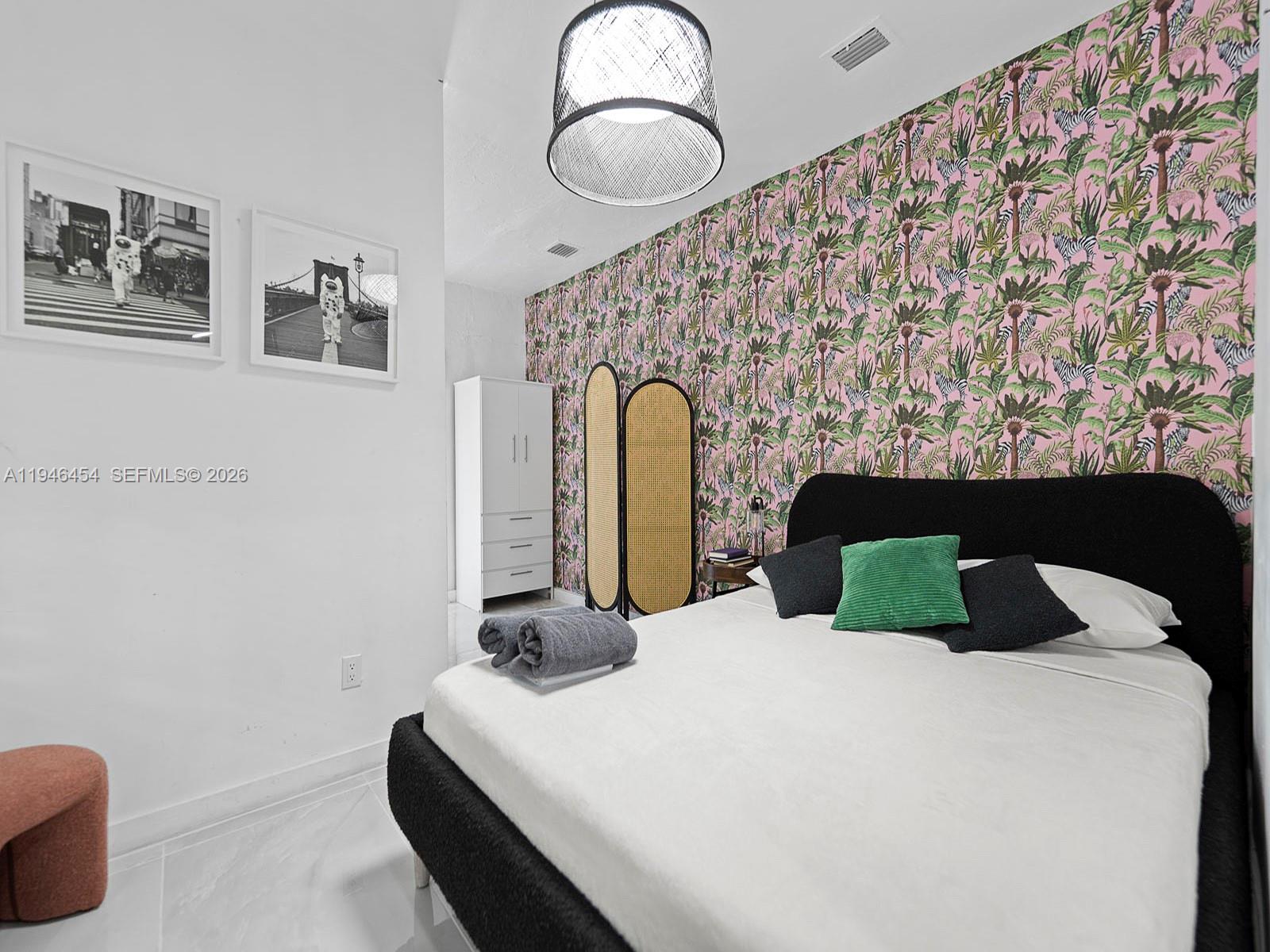 1845 Southwest 9th Street Miami, FL 33135 - Photo 15 of 31 a bedroom with a bed and a painting on the wall