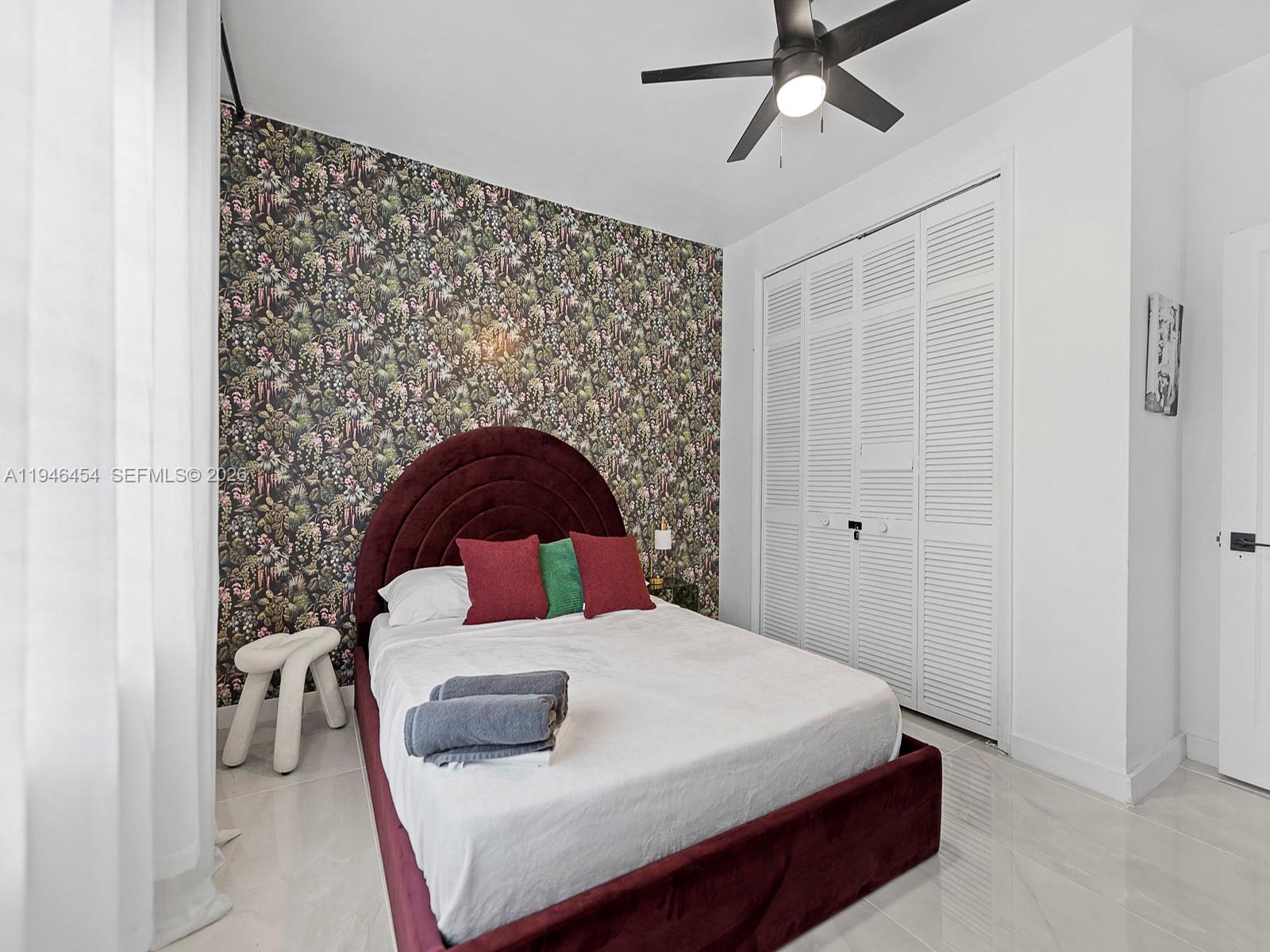 1845 Southwest 9th Street Miami, FL 33135 - Photo 16 of 31 a bedroom with a bed and a window
