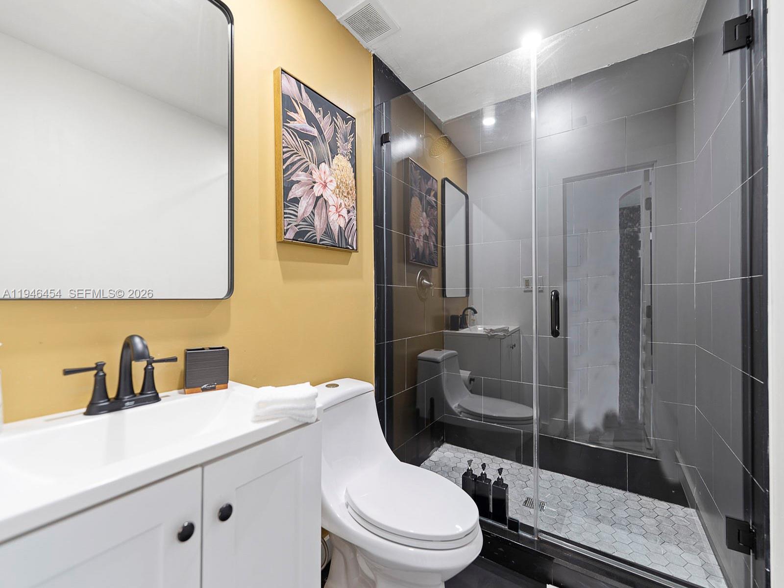 1845 Southwest 9th Street Miami, FL 33135 - Photo 18 of 31 a bathroom with a toilet sink and shower