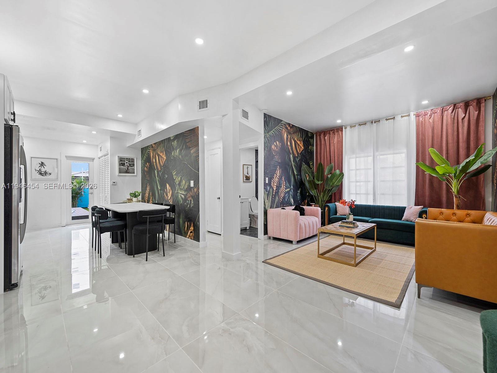 1845 Southwest 9th Street Miami, FL 33135 - Photo 6 of 31 a living room with furniture and a large window