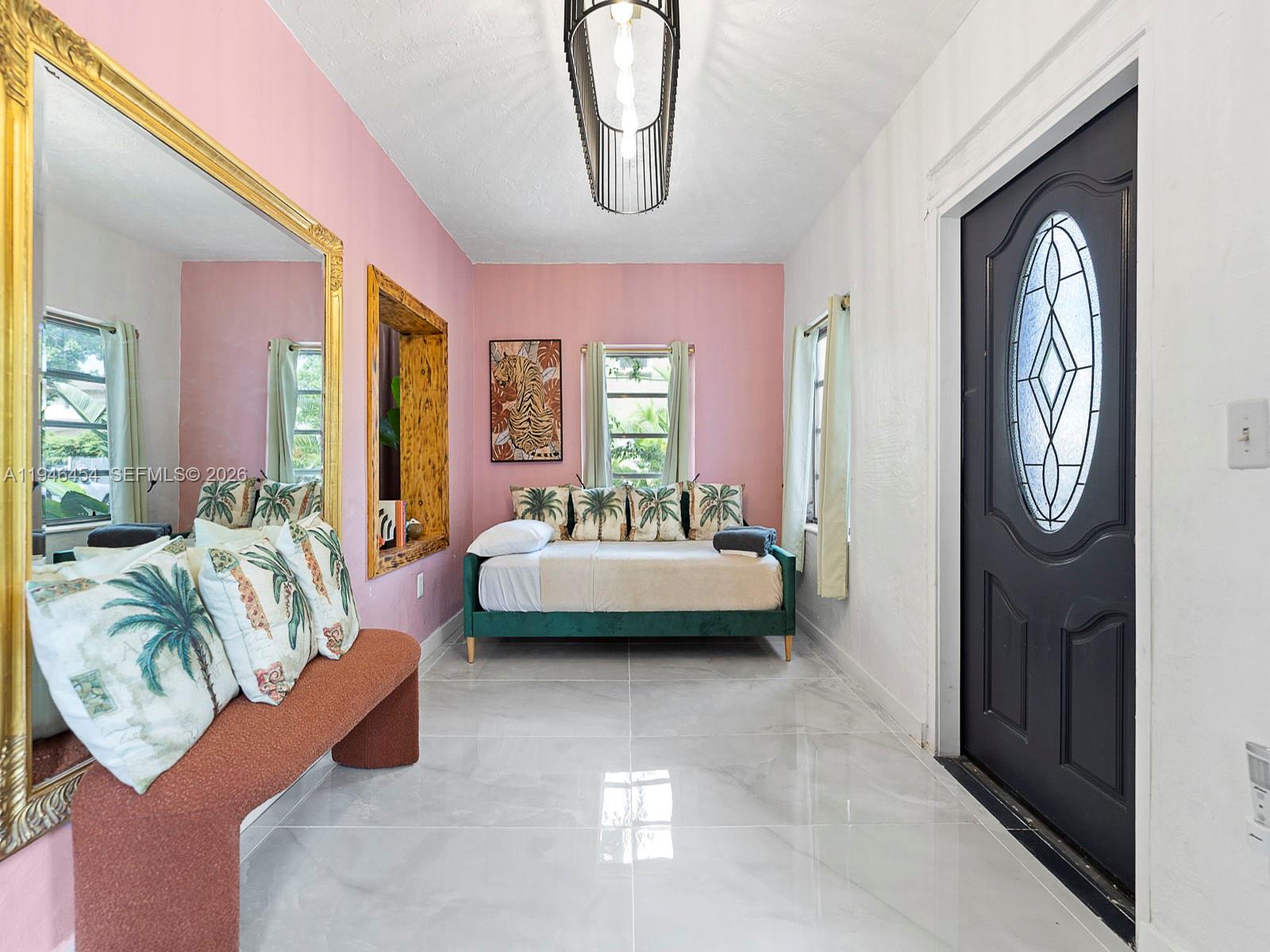 1845 Southwest 9th Street Miami, FL 33135 - Photo 8 of 31 a bedroom with furniture and a large window