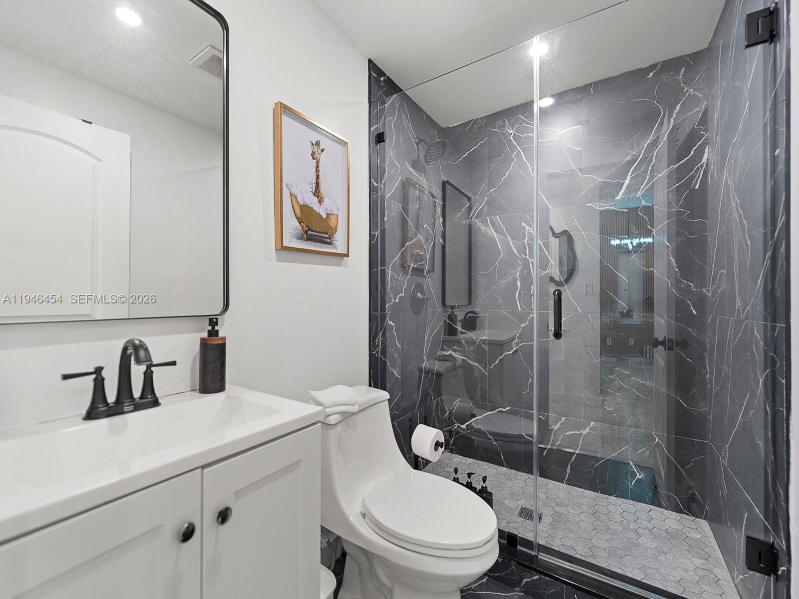 1845 Southwest 9th Street Miami, FL 33135 - Photo 9 of 31 a bathroom with a sink a toilet and shower
