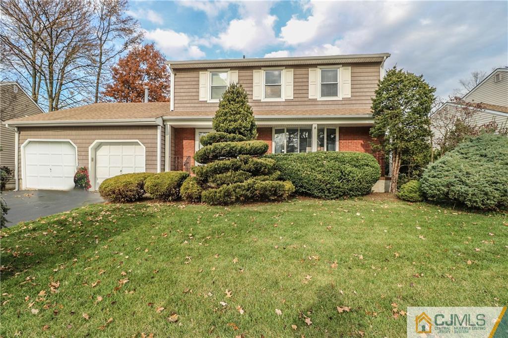 7 Paddock Court Edison, NJ 08820 - Photo 1 of 23 a front view of a house with a garden