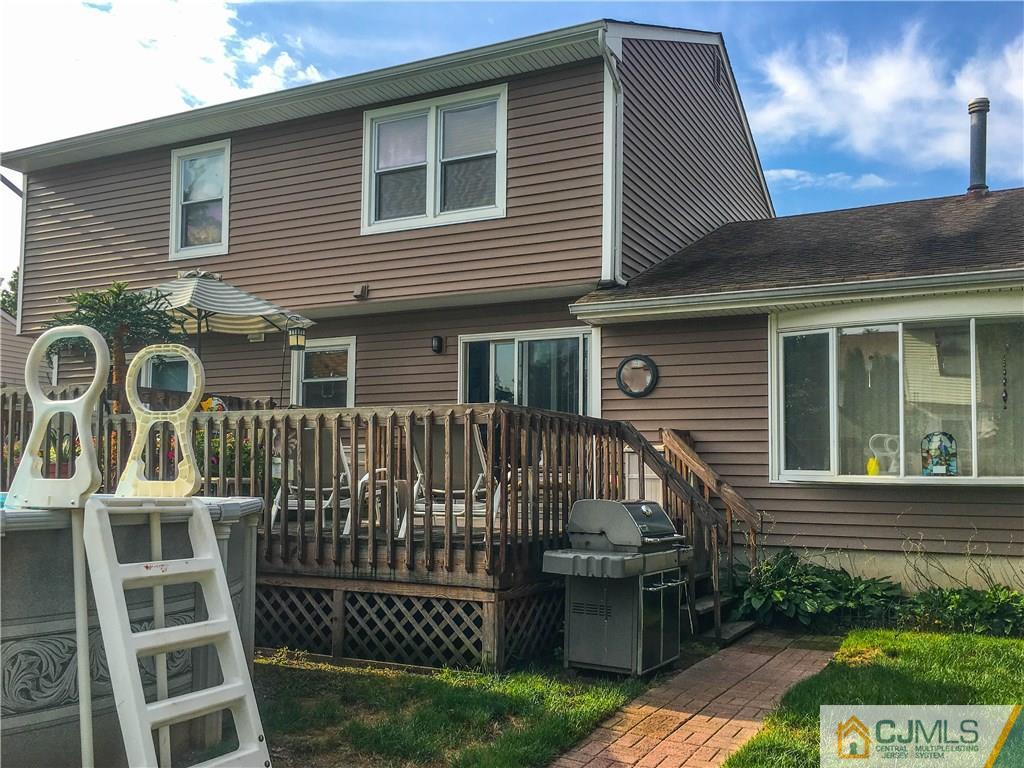 7 Paddock Court Edison, NJ 08820 - Photo 21 of 23 a front view of a house with a garden
