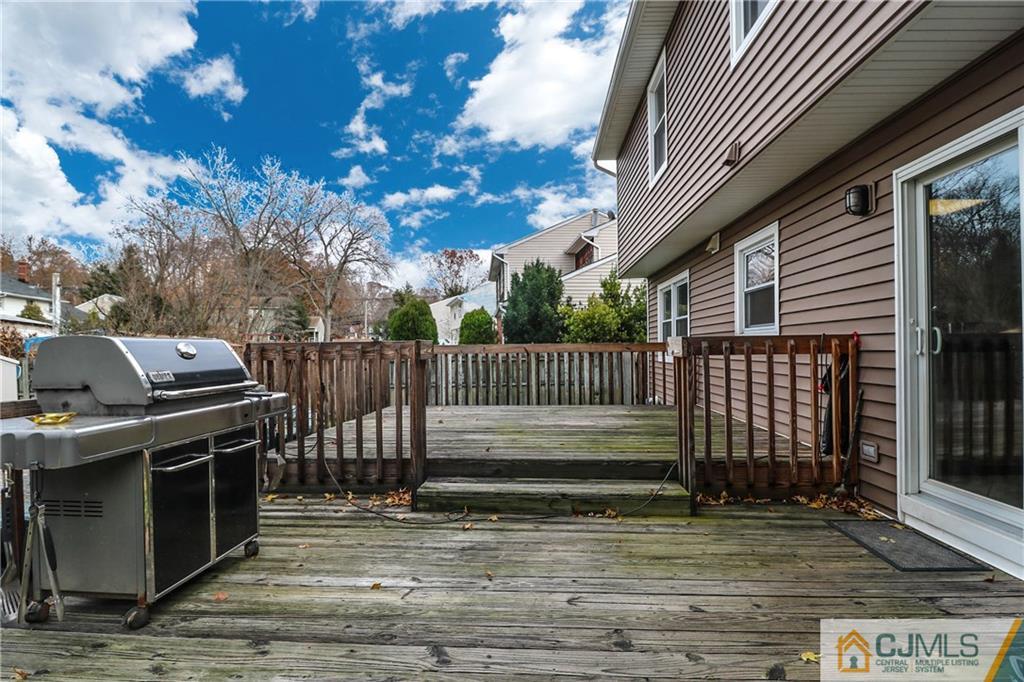 7 Paddock Court Edison, NJ 08820 - Photo 22 of 23 a view of a patio with a table and chairs