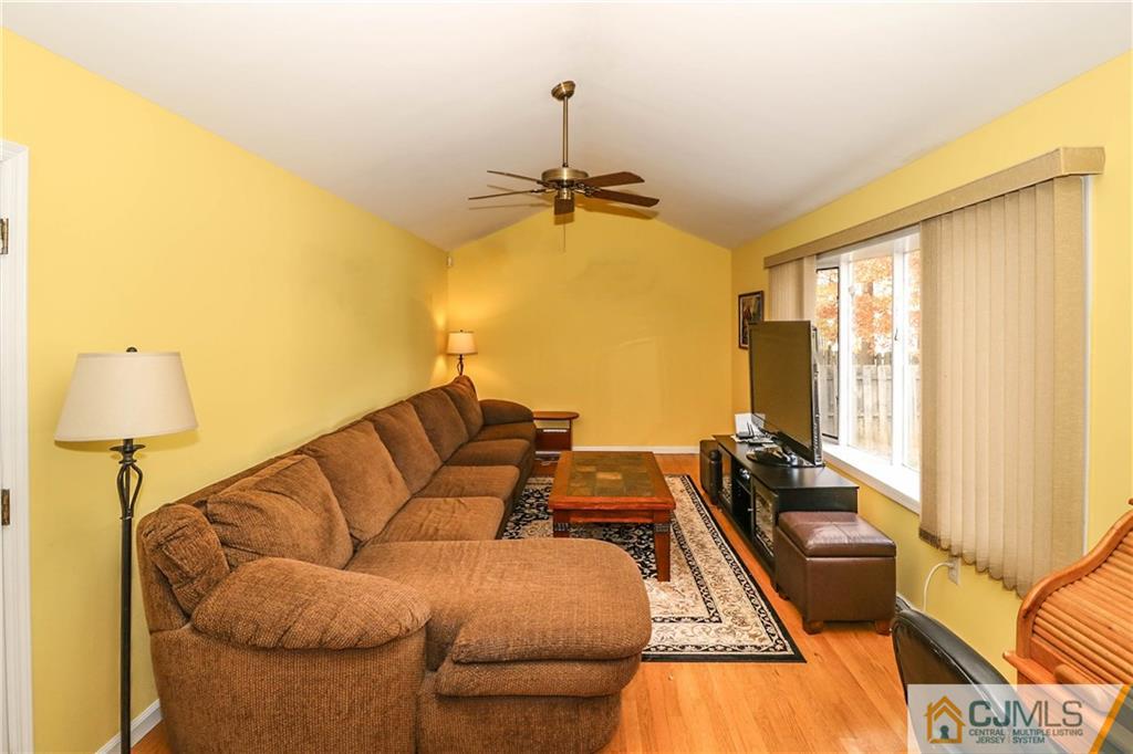 7 Paddock Court Edison, NJ 08820 - Photo 4 of 23 a living room with furniture and a window