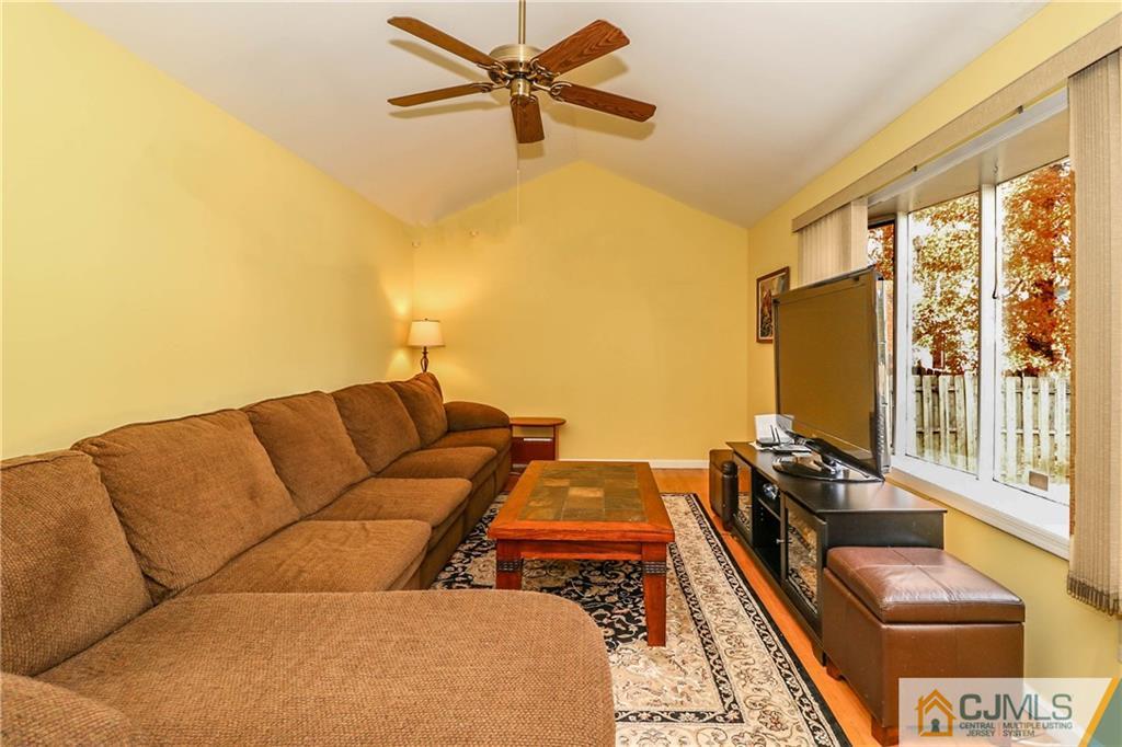 7 Paddock Court Edison, NJ 08820 - Photo 5 of 23 a living room with furniture and a large window