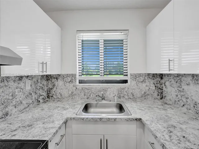 a bathroom with a sink and granite