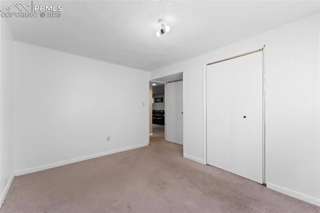 a view of an empty room with an entryway