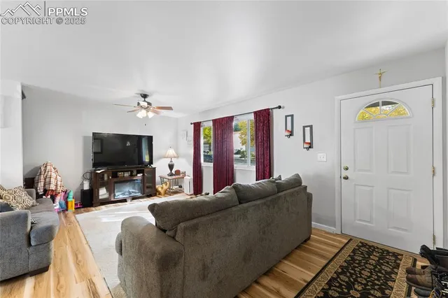a living room with furniture and a flat screen tv