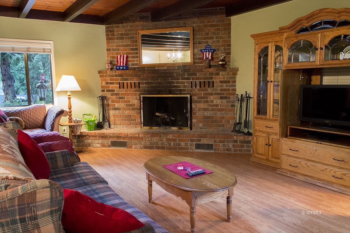 54955 South Circle Drive Idyllwild, CA 92549 - Photo 10 of 31 a living room with furniture and a fireplace