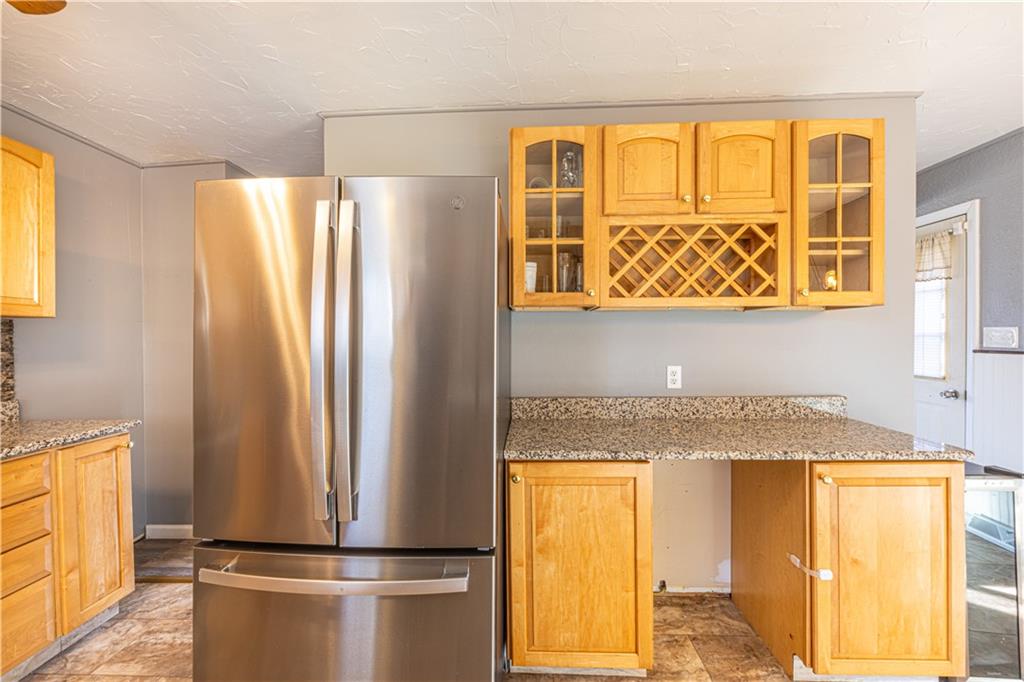 411 McClellandtown Road Uniontown, PA 15401 - Photo 15 of 33 a view of a refrigerator a sink and dishwasher with wooden floor