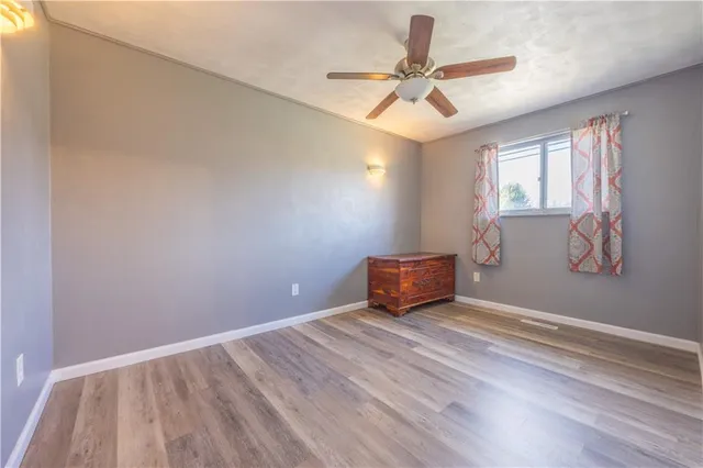 a view of room with window and ceiling fan