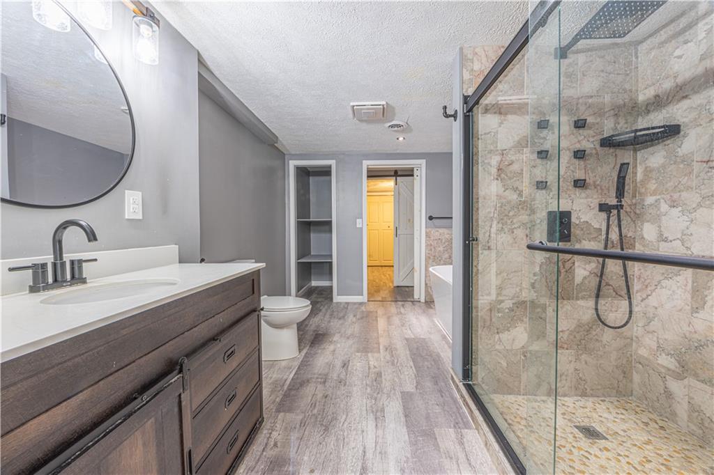 411 McClellandtown Road Uniontown, PA 15401 - Photo 28 of 33 a spacious bathroom with a shower sink and mirror