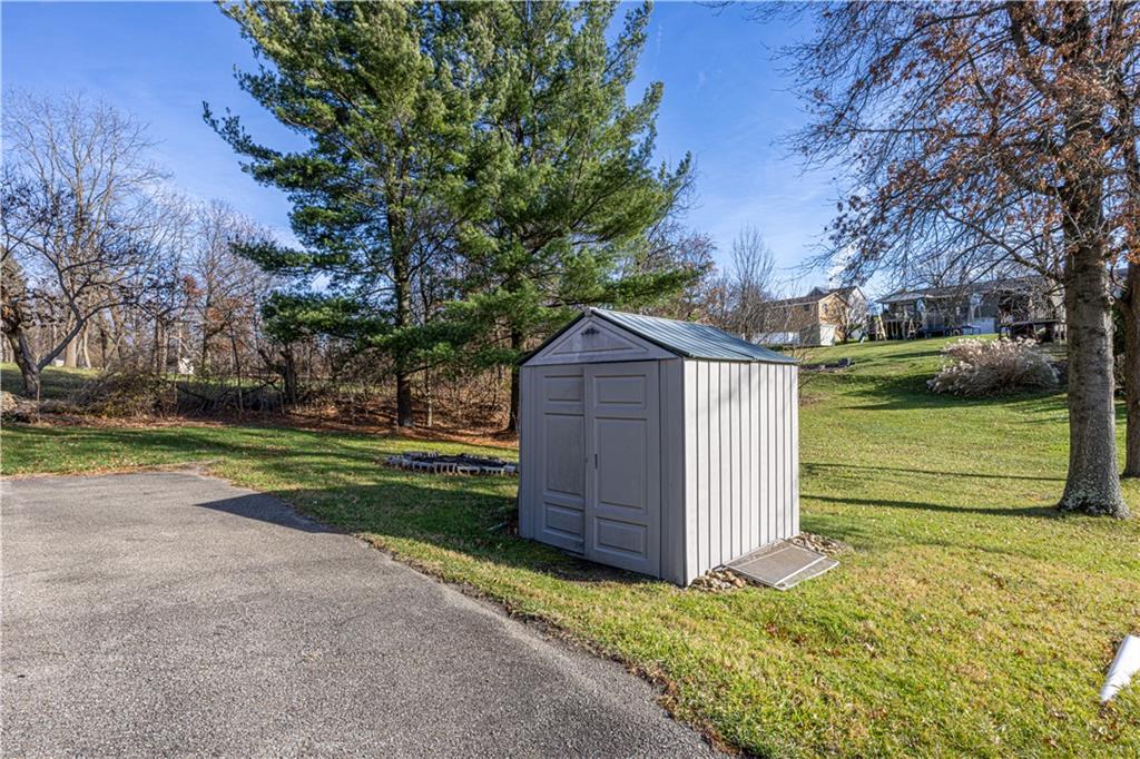 411 McClellandtown Road Uniontown, PA 15401 - Photo 3 of 33 a view of a backyard with large trees