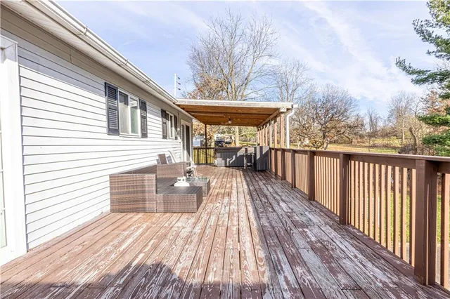 a view of a house with backyard and wooden floor