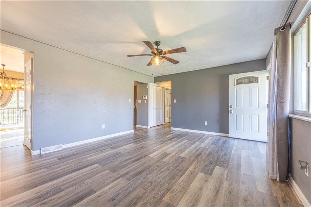 411 McClellandtown Road Uniontown, PA 15401 - Photo 9 of 33 wooden floor in an empty room with a window
