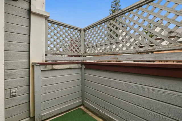 a view of kitchen with refrigerator and a sink