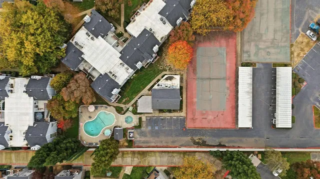 an aerial view of a house with a yard