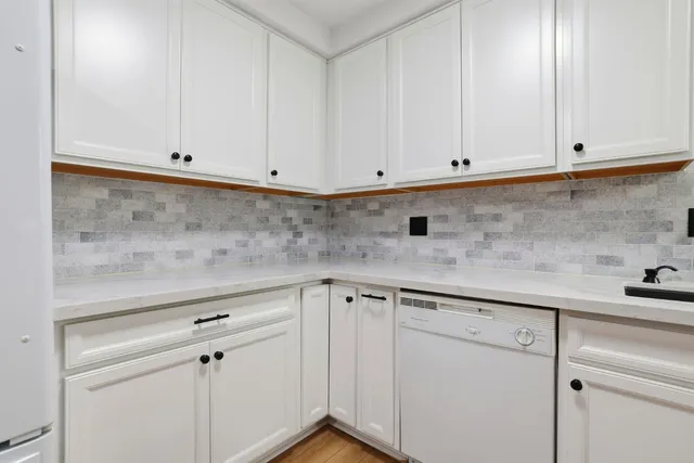 a view of cabinets and window